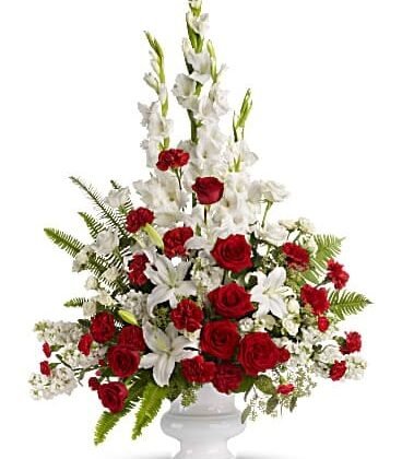 Red roses paired with dainty white flowers